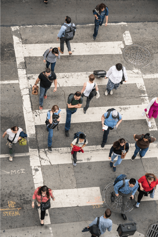 Above view of pedestrians crossing the street