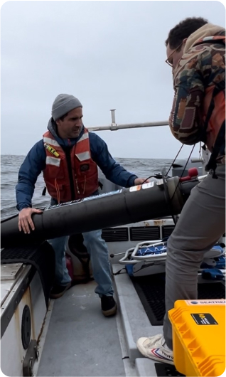 People on boat use innovative seatrec`s robots to generate electricity